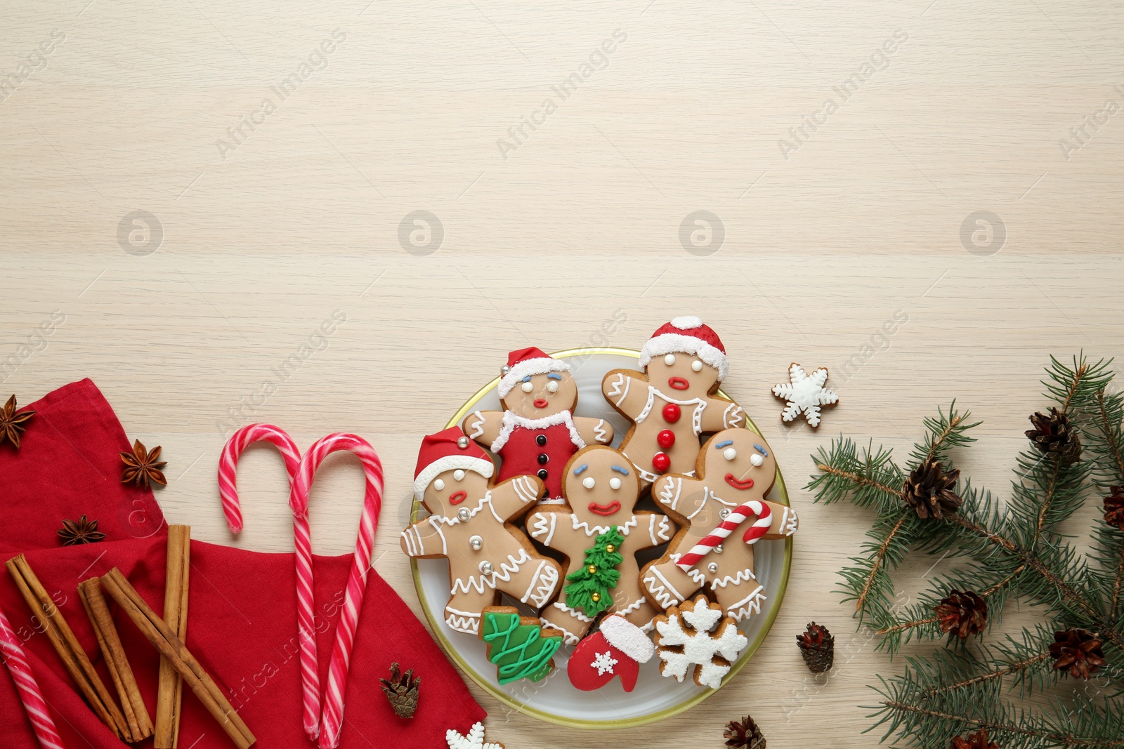 Photo of Flat lay composition with delicious Christmas cookies on beige wooden table, space for text