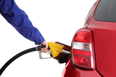 Photo of Worker filling up car with fuel on white background, closeup. Gas station