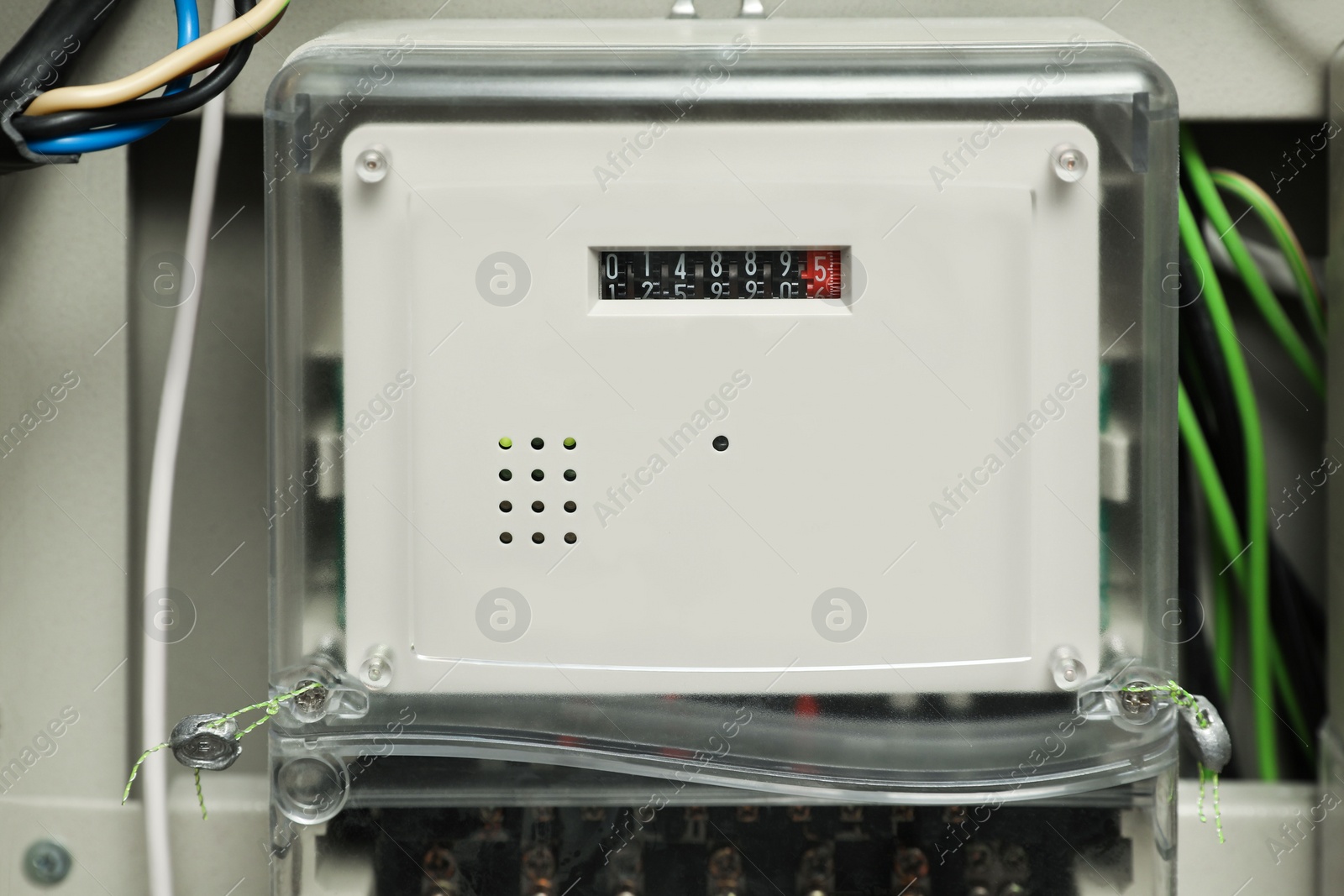 Photo of Electric meter and wires in fuse box, closeup