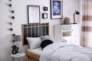 Modern teenager room interior with comfortable bed