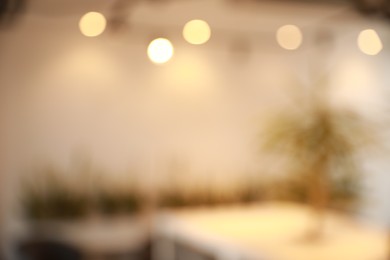 Photo of Blurred view of beautiful modern cafe interior