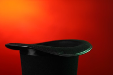 Photo of Magician's hat on color background, space for text