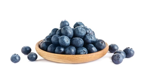 Photo of Plate of fresh raw blueberries isolated on white