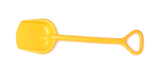 Photo of Yellow plastic toy shovel isolated on white, top view