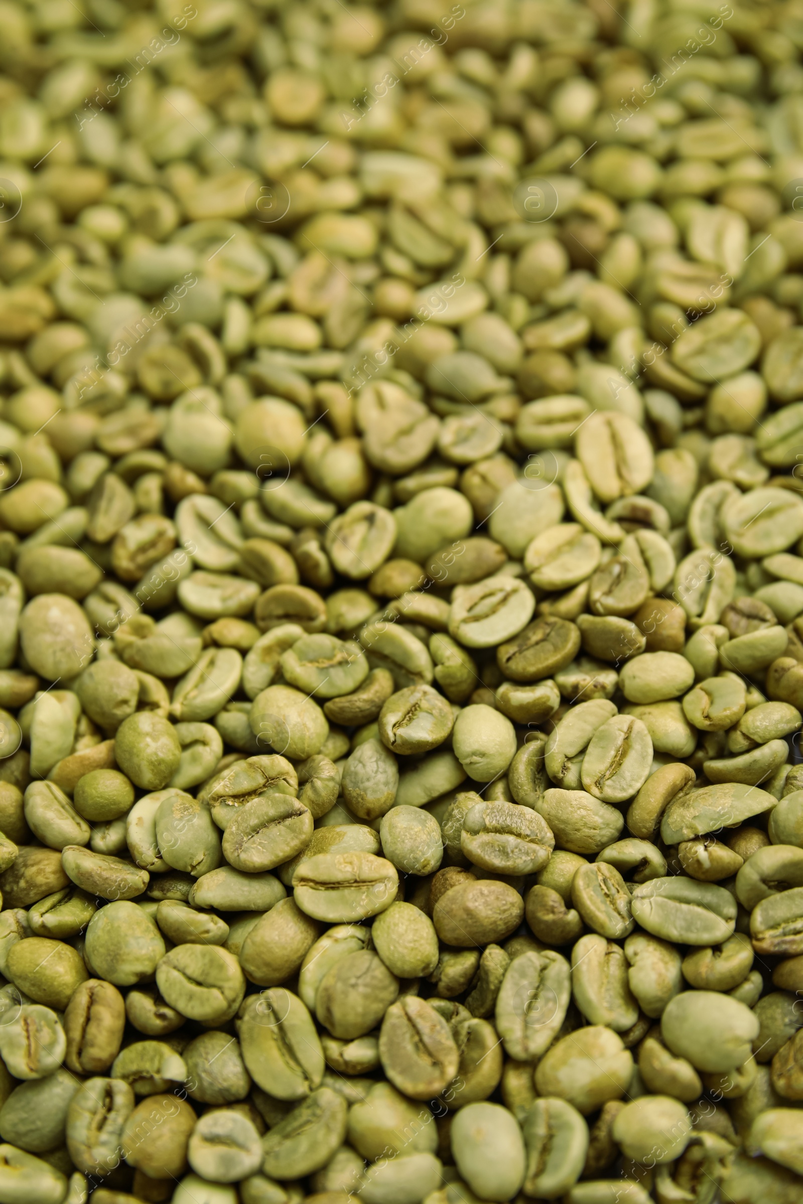 Photo of Pile of green coffee beans as background, closeup