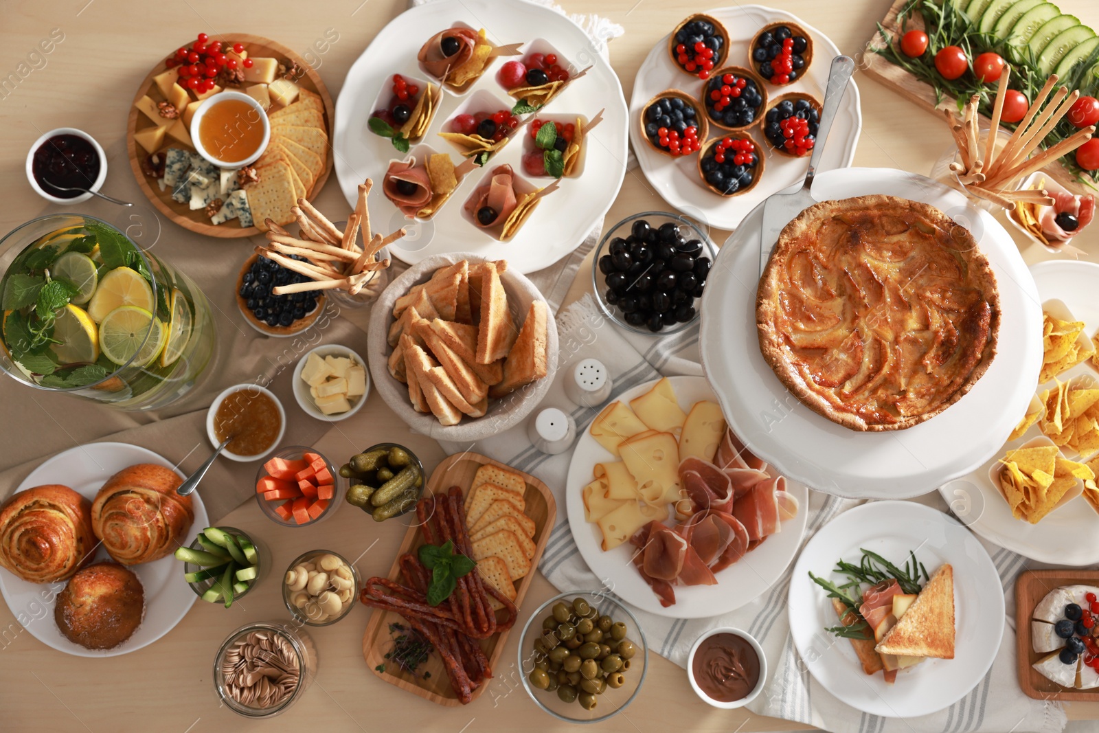 Photo of Dishes with different food on table, flat lay. Luxury brunch