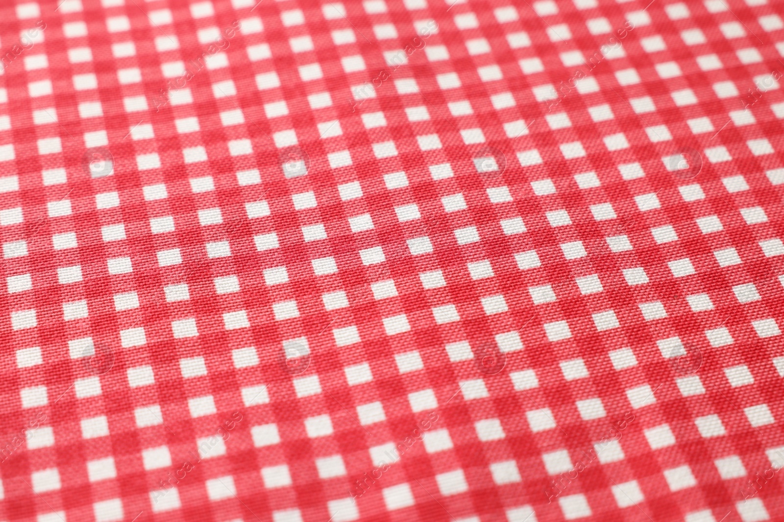 Photo of Red checkered tablecloth as background, closeup view