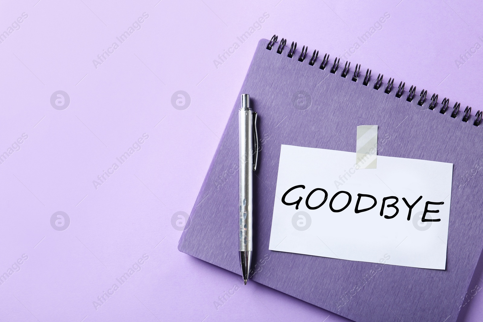 Image of Note with word Goodbye, notebook and pen on violet background, space for text