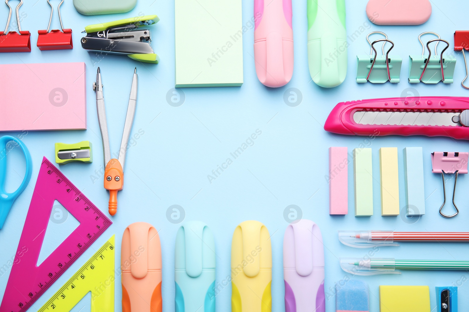 Photo of Frame of different school stationery on light blue background, flat lay. Back to school