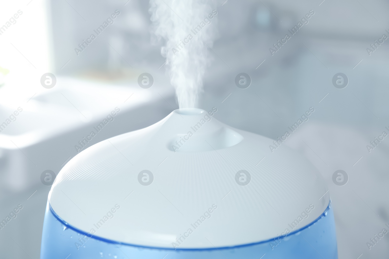 Photo of Modern air humidifier at home, closeup view