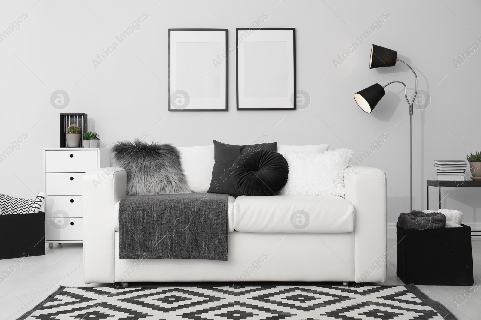 Photo of Elegant white sofa in modern living room interior