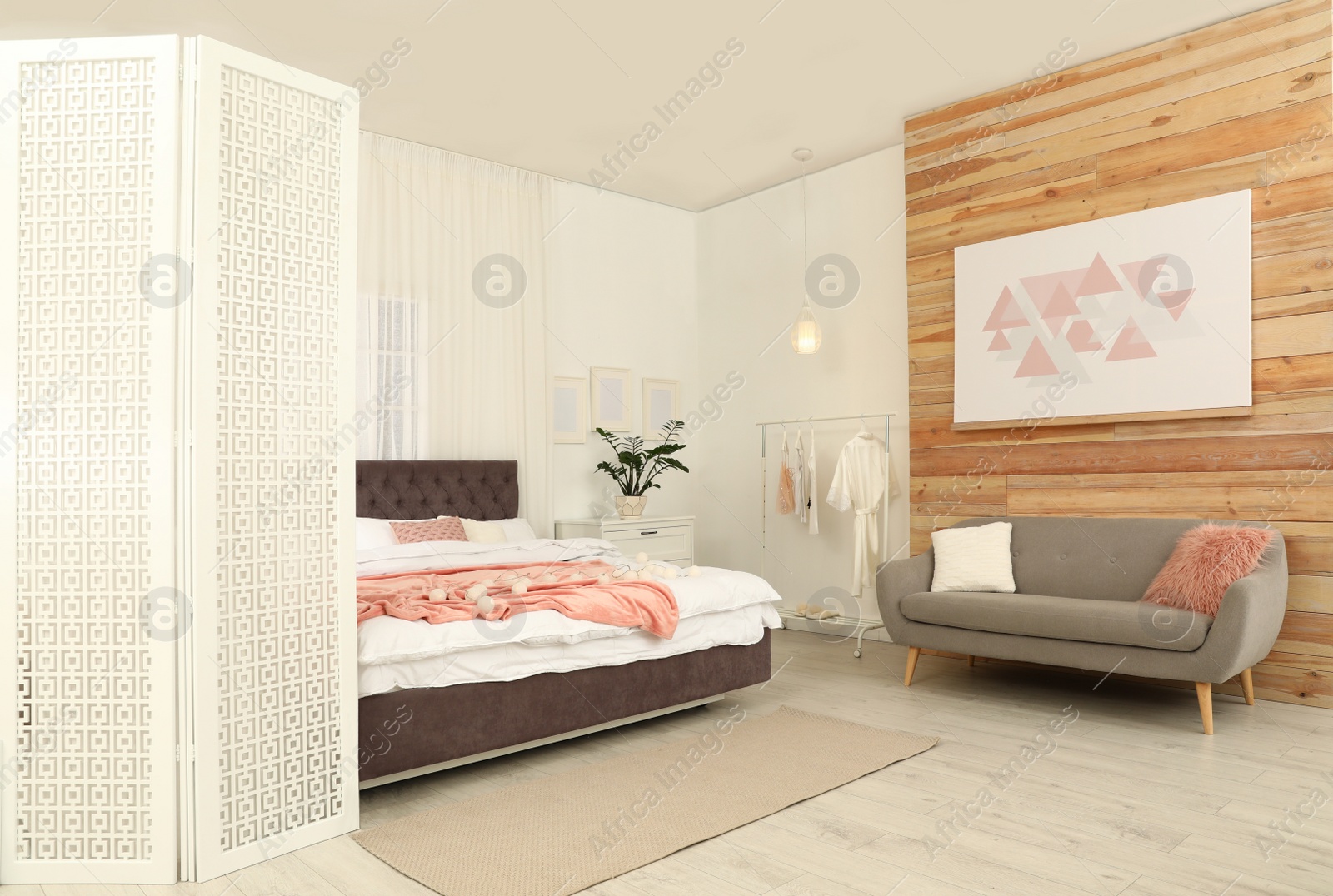 Photo of Modern folding screen in stylish room interior