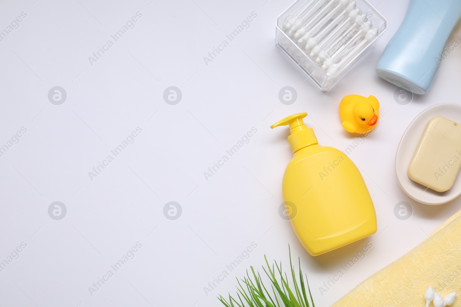 Photo of Different baby bath accessories and cosmetic products on white background, flat lay. Space for text