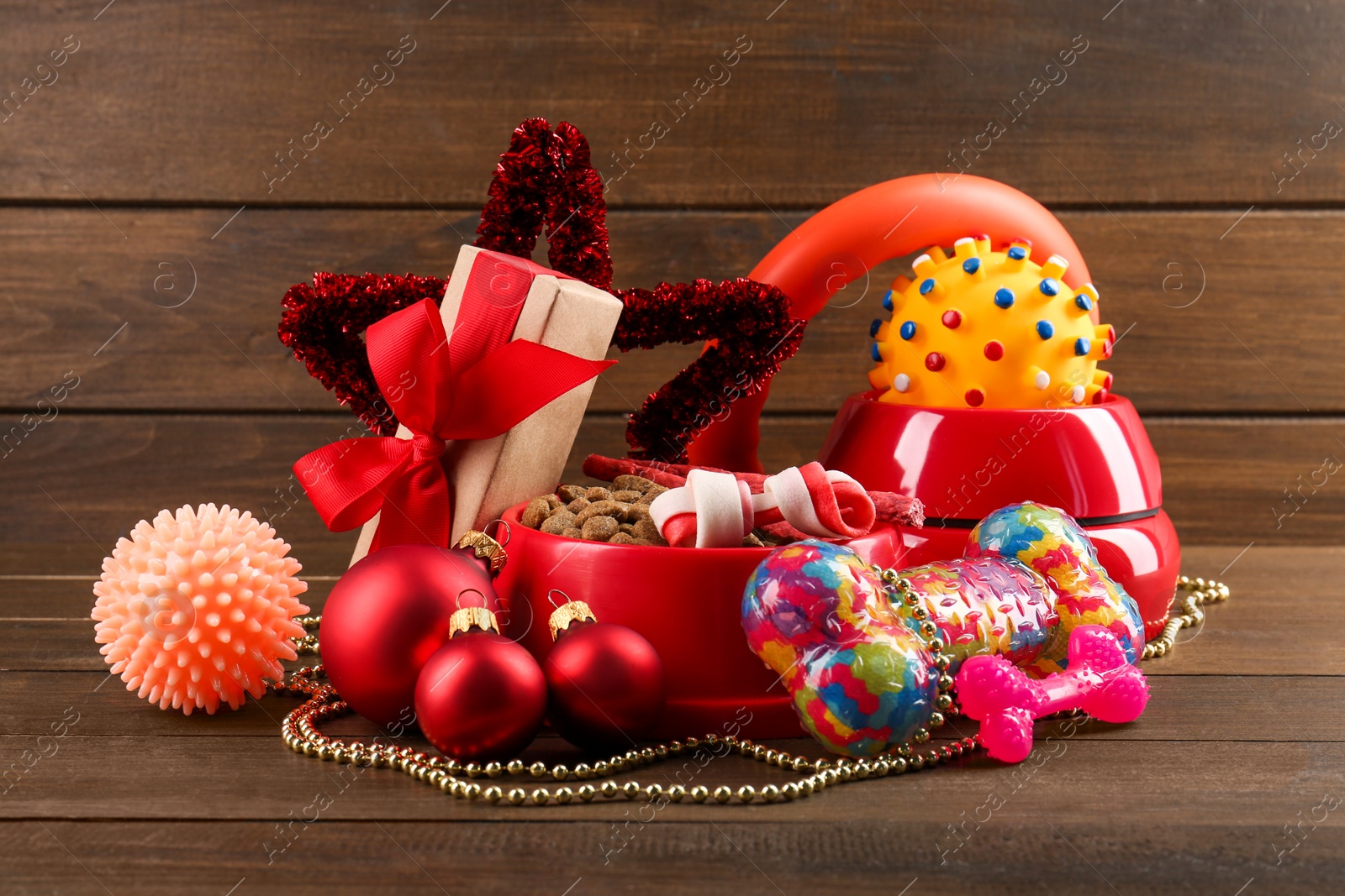 Photo of Different colorful pet shop goods on wooden background