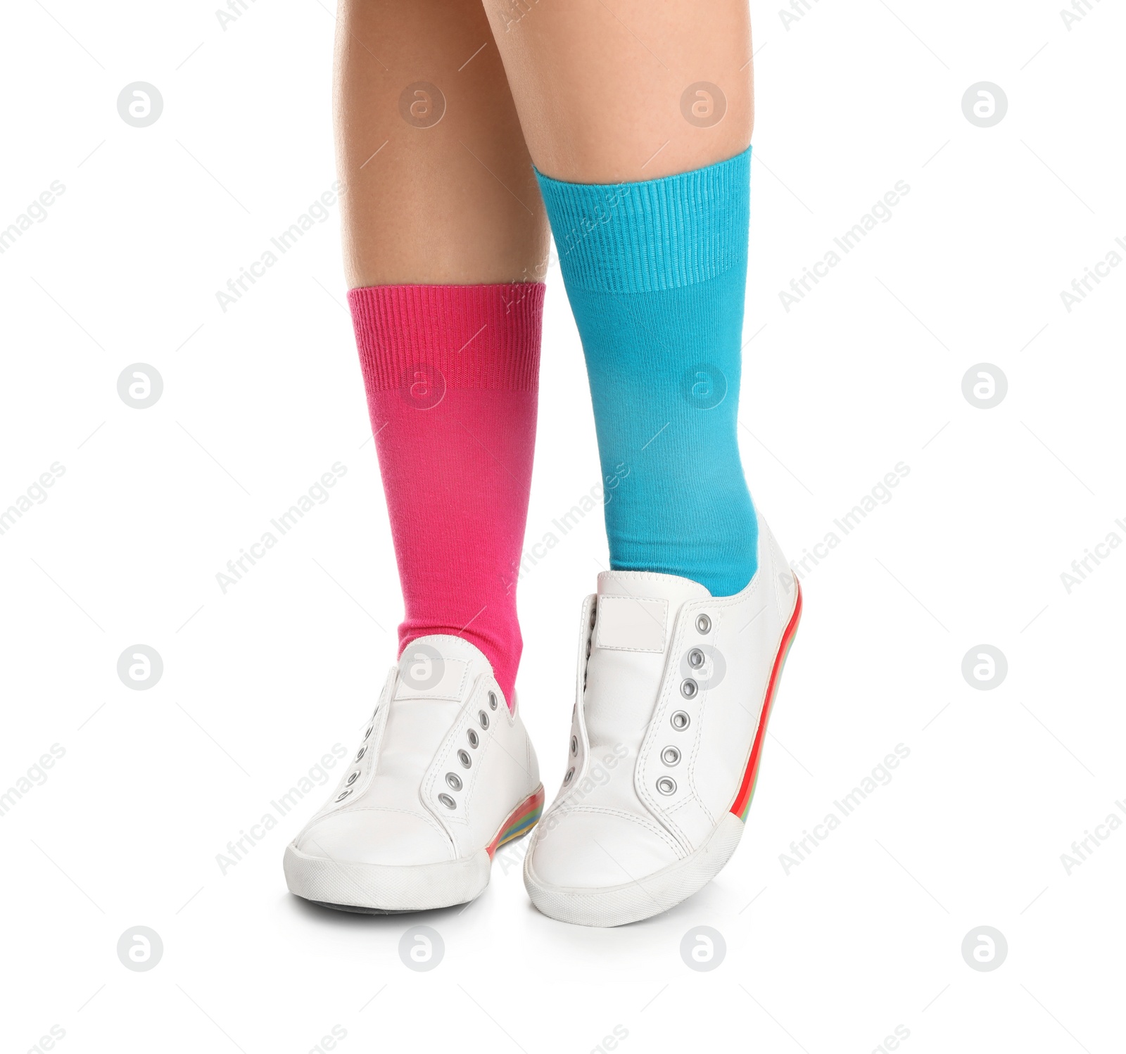 Photo of Woman in stylish socks and shoes on white background, closeup