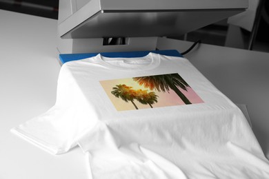 Image of Custom t-shirt. Using heat press to print image of beautiful tropical palm trees, closeup