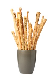 Delicious grissini sticks in cup on white background