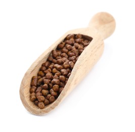 Photo of Wooden scoop with buckwheat tea granules on white background