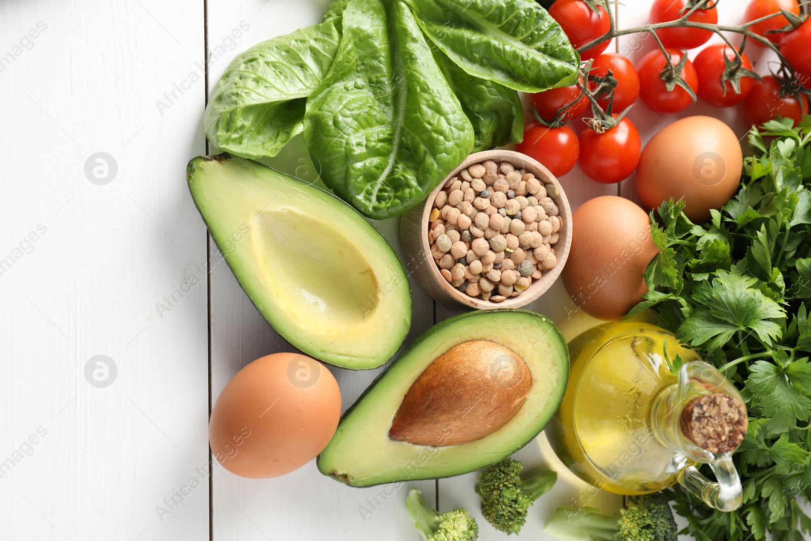 Photo of Many different healthy food on white wooden table, flat lay