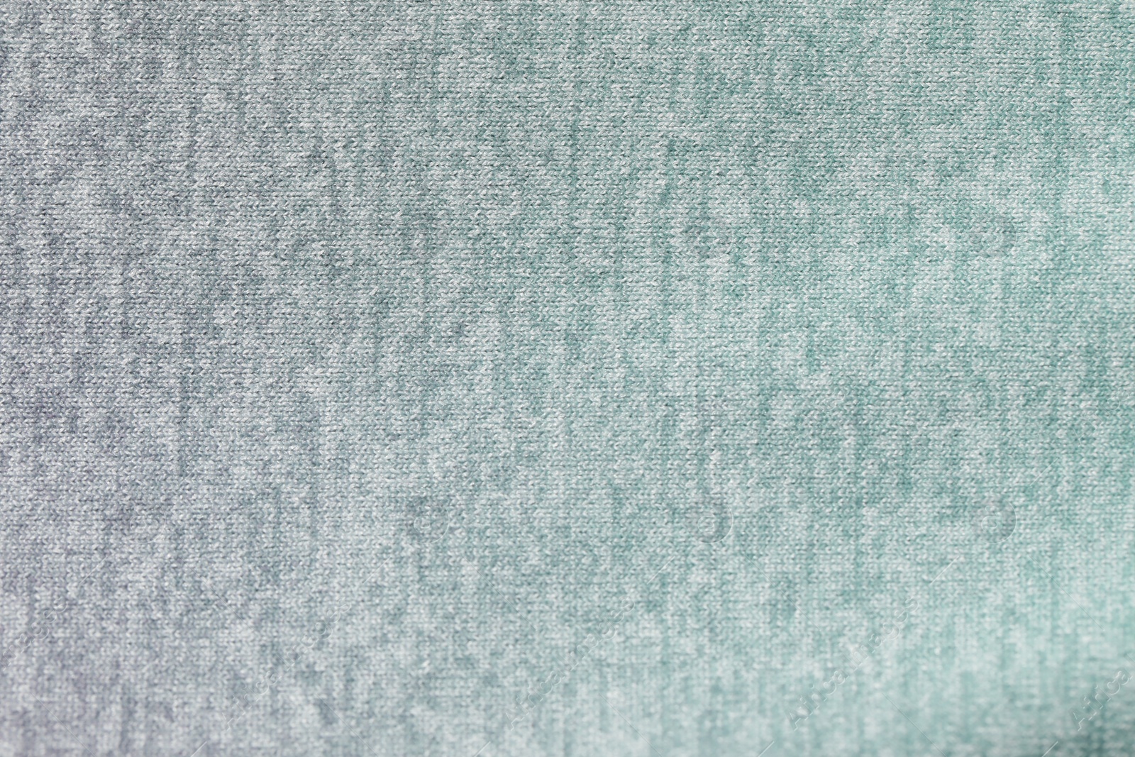 Photo of Texture of soft color fabric as background, top view