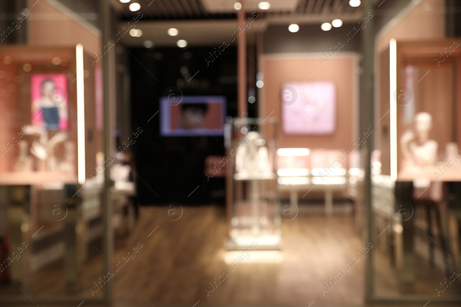 Photo of Blurred view of modern shopping mall interior. Bokeh effect