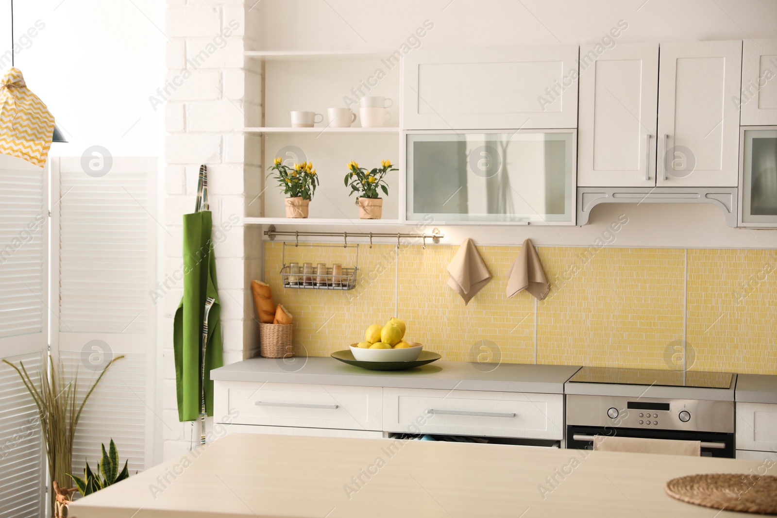 Photo of Modern kitchen interior with stylish white furniture