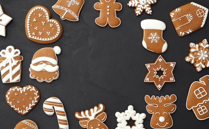 Photo of Frame of delicious Christmas cookies on black table, flat lay. Space for text