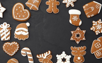 Frame of delicious Christmas cookies on black table, flat lay. Space for text