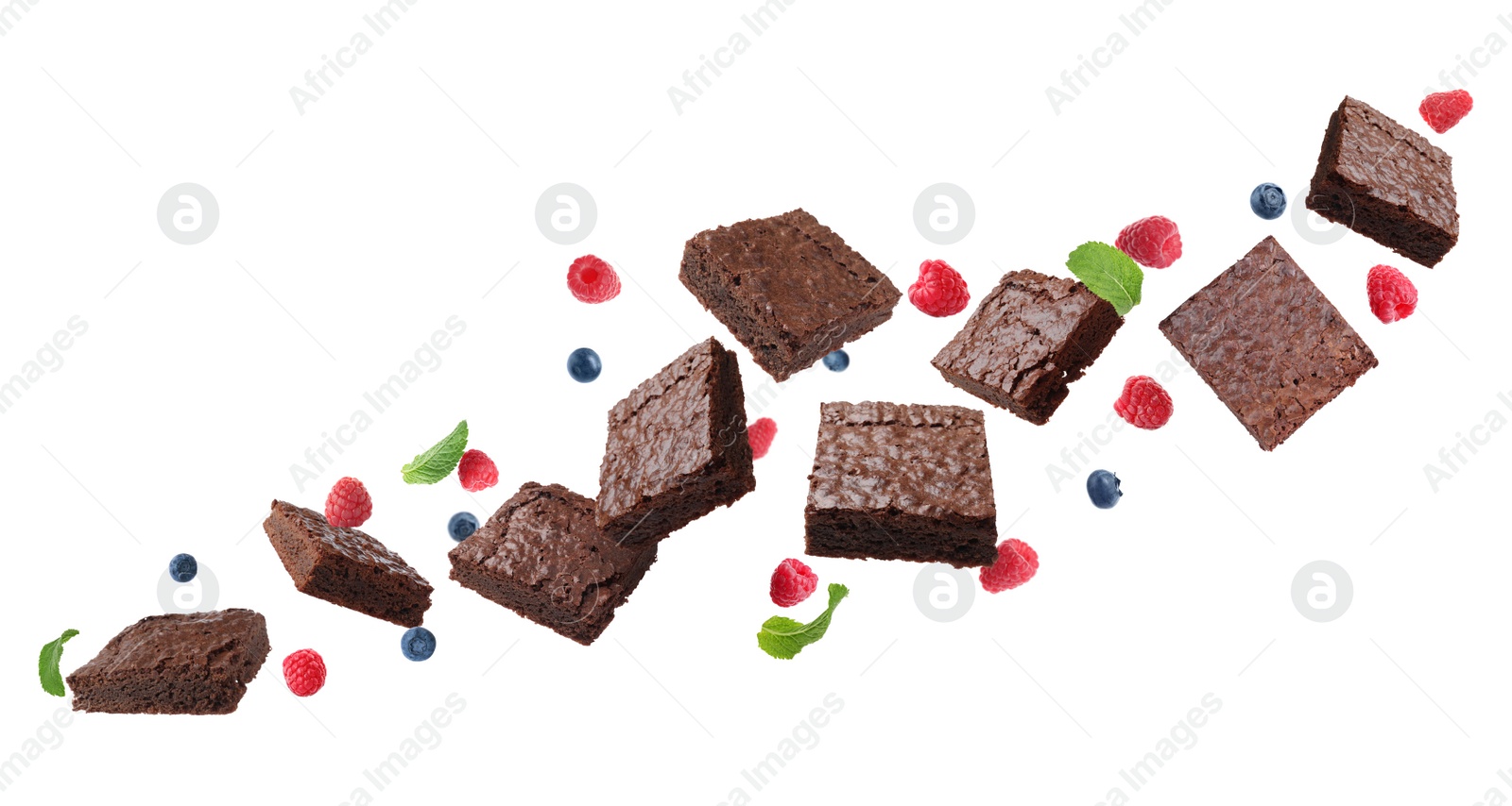 Image of Slices of delicious chocolate brownie with fresh berries and mint flying on white background. Banner design