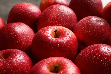 Photo of Fresh red apples with drops of water, closeup