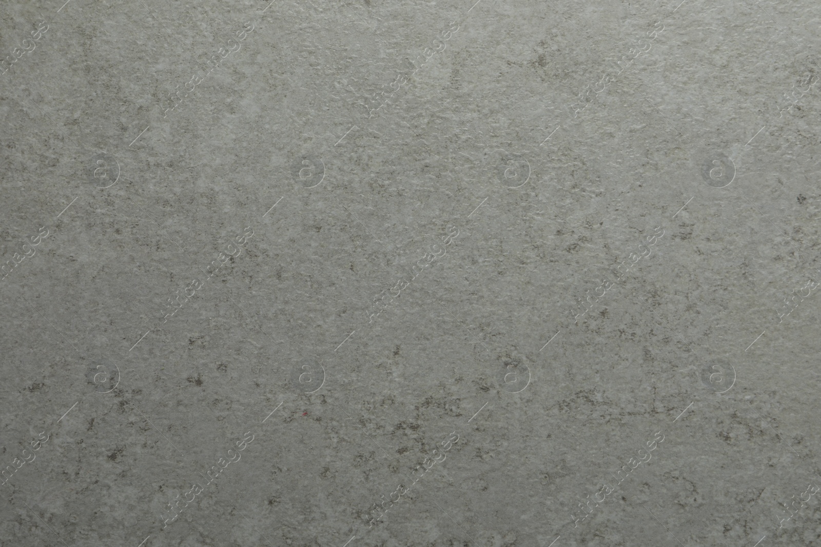 Photo of Texture of light grey stone surface as background, closeup