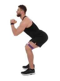 Photo of Young man exercising with elastic resistance band on white background