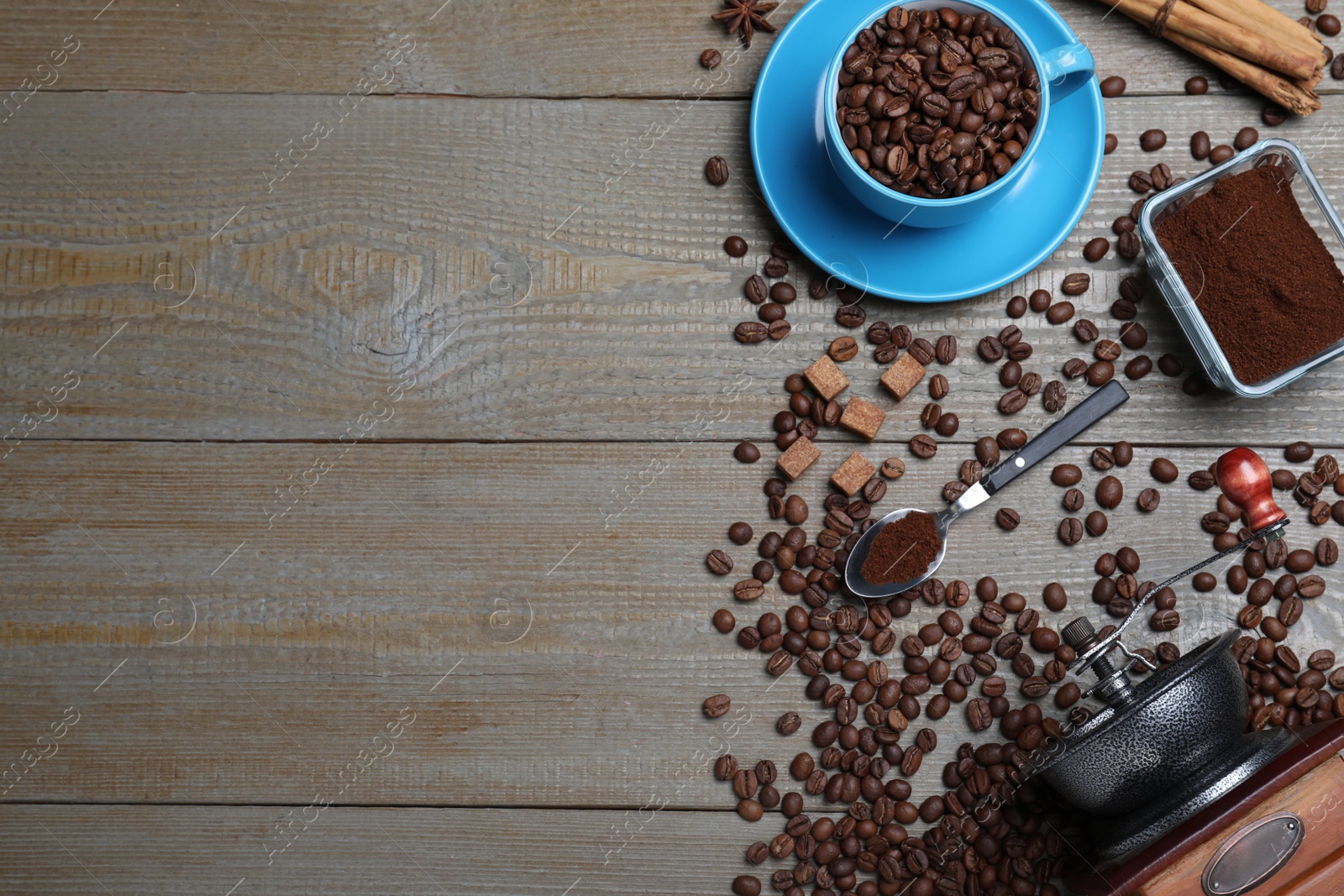 Photo of Flat lay composition with roasted coffee beans on wooden table. Space for text