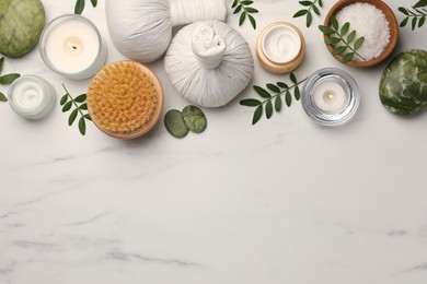 Photo of Flat lay composition with different spa products on white marble table. Space for text