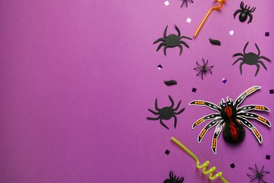 Flat lay composition with spiders, confetti and straws on purple background, space for text. Halloween celebration