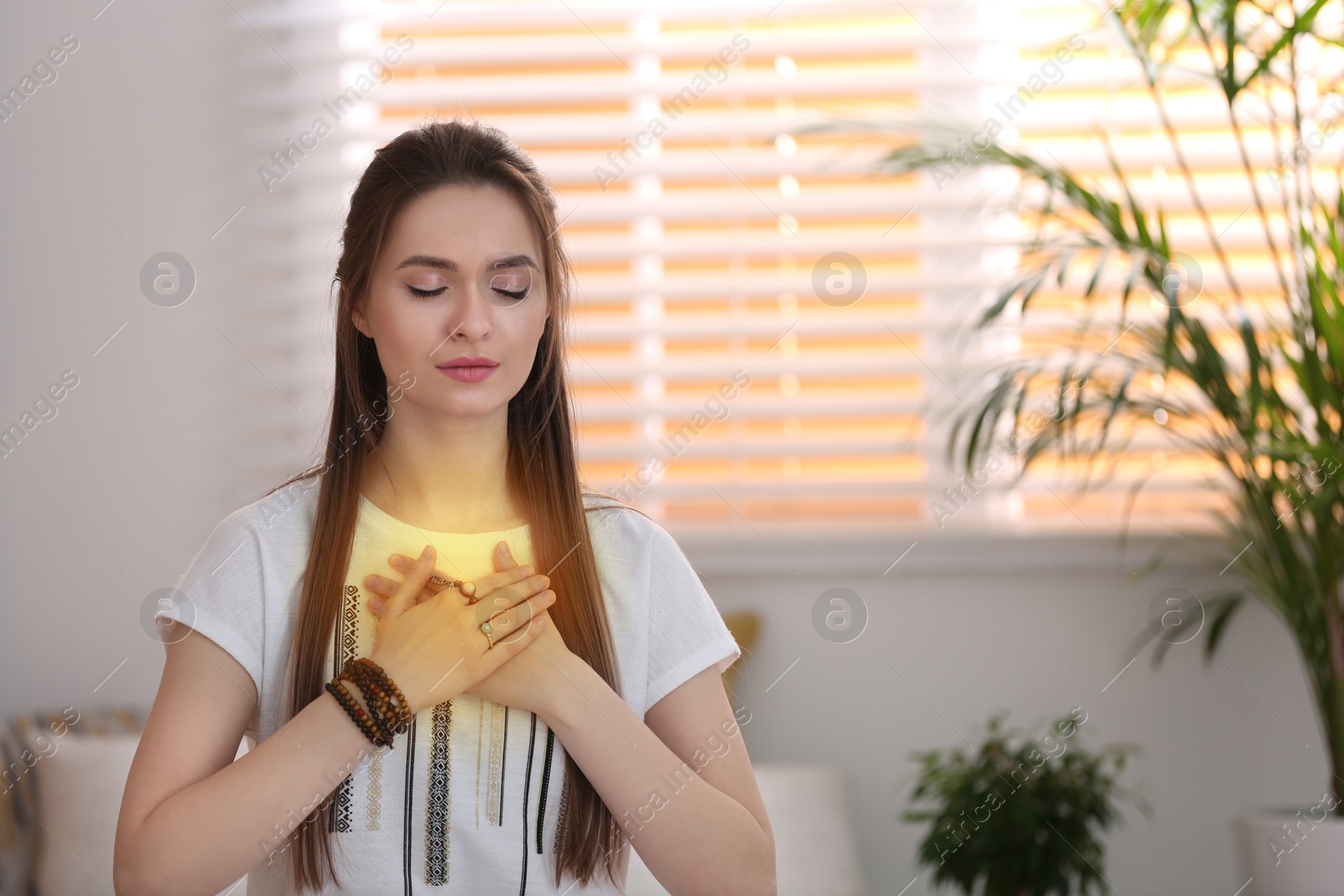 Photo of Young woman during self-healing session in therapy room