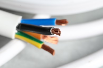 Photo of Colorful electrical wire on blurred background, closeup