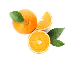 Photo of Cut and whole fresh ripe oranges with green leaves on white background, top view