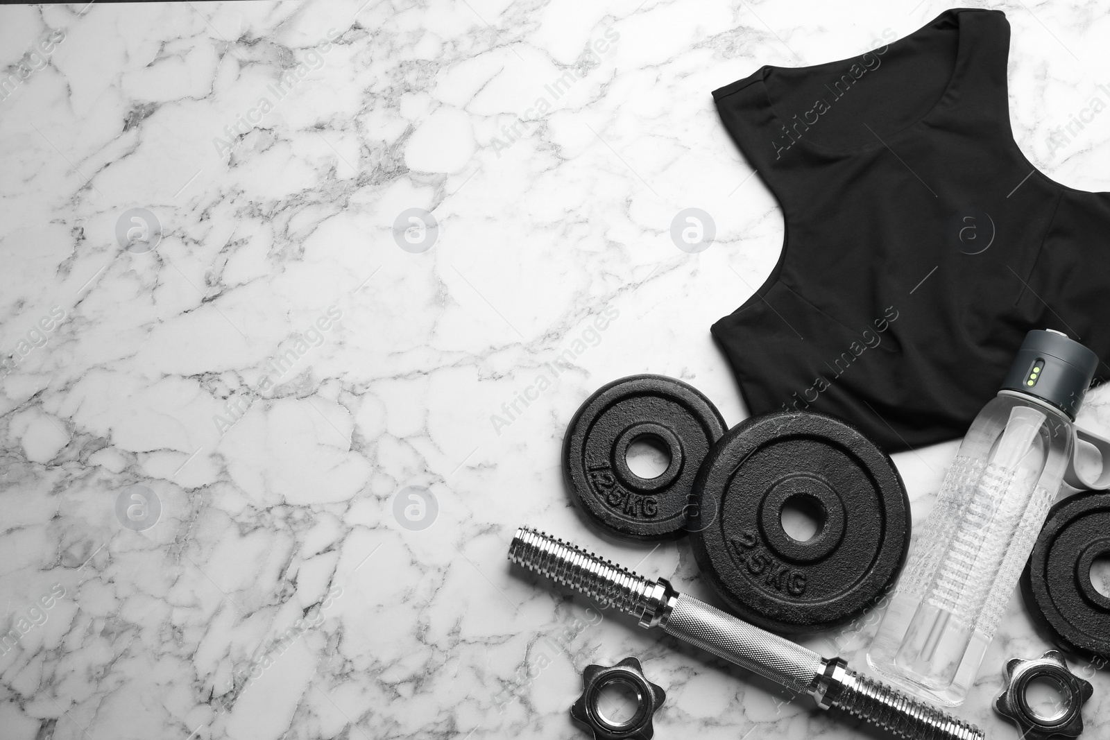 Photo of Flat lay composition with sportswear and equipment on white marble table, space for text. Gym workout