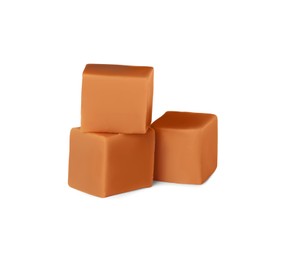 Heap of caramel candies on white background