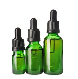 Photo of Cosmetic bottles of essential oils on white background