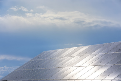 Photo of Solar panels installed outdoors. Alternative energy source