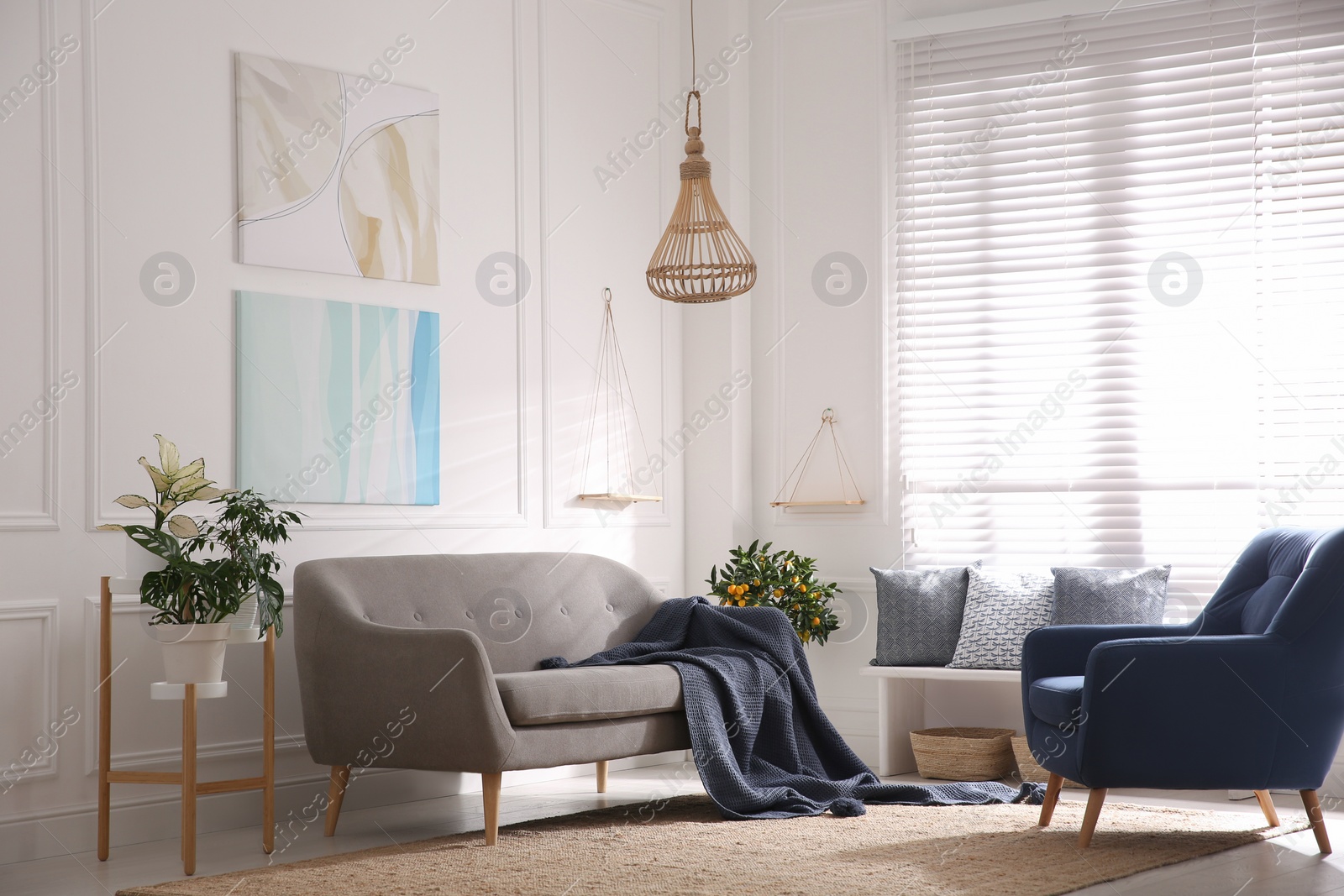 Photo of Beautiful living room interior with comfortable gray sofa