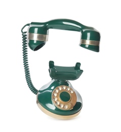 Photo of Elegant vintage green telephone isolated on white