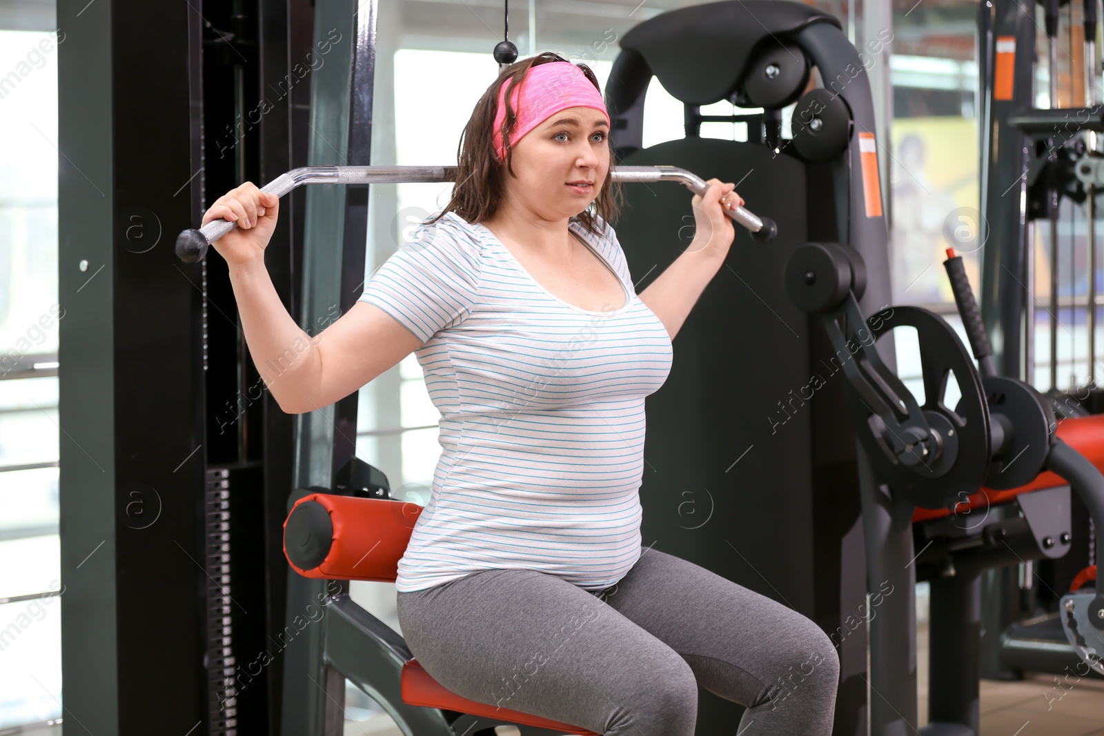 Photo of Overweight woman training in gym
