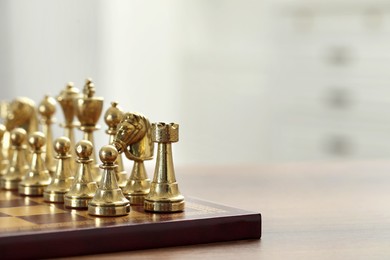 Chess board with pieces on table, closeup. Space for text