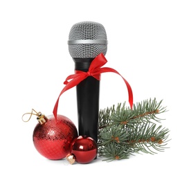 Photo of Microphone with red bow and festive decor on white background. Christmas music
