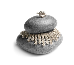 Photo of Stones with elegant shiny jewelry on white background
