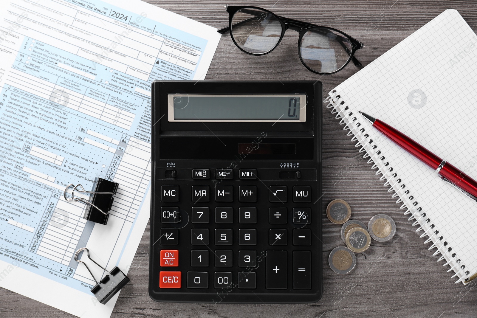 Photo of Tax accounting. Flat lay composition with calculator and document on wooden table