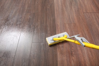 Image of Washing of floor with mop. Difference before and after cleaning